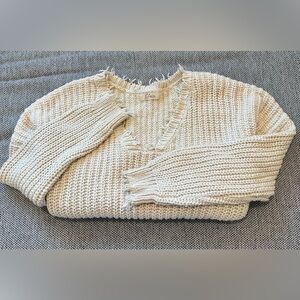 Cream distressed V-neck sweater
